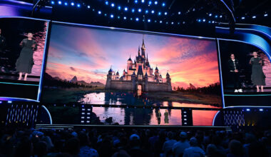 An image of Ginnifer Goodwin and Ke Huy Quan on stage at the Honda Center during the Disney Entertainment Showcase at D23: The Ultimate Disney Fan Event 2026.