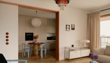 An open-plan living and kitchen space toys with colour and calm &ndash; white walls with bright furniture.