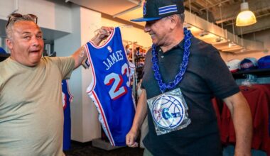 Roger Franco (left) and Humberto Alarcon were among the Sixers fans shopping for LeBron James merchandise during a two-day sale at the 76ers team store at Xfinity Mobile Arena.