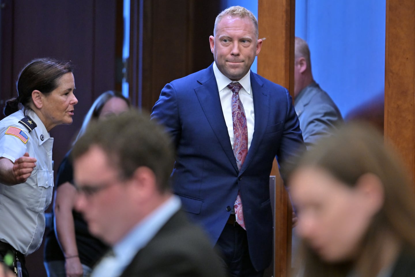 Timothy Chiappini, a cell forensics expert with the Massachusetts State Police enters the courtroom to testify testimony in the murder trial of Lindsay Clancy, Thursday, Aug. 13, 2026., in Plymouth, Mass.  