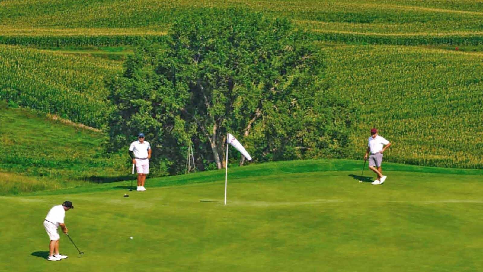 The pins at Landmand Golf Club are marked with windsocks instead of flags to help golfers see them and know how hard the ever-present wind was blowing.