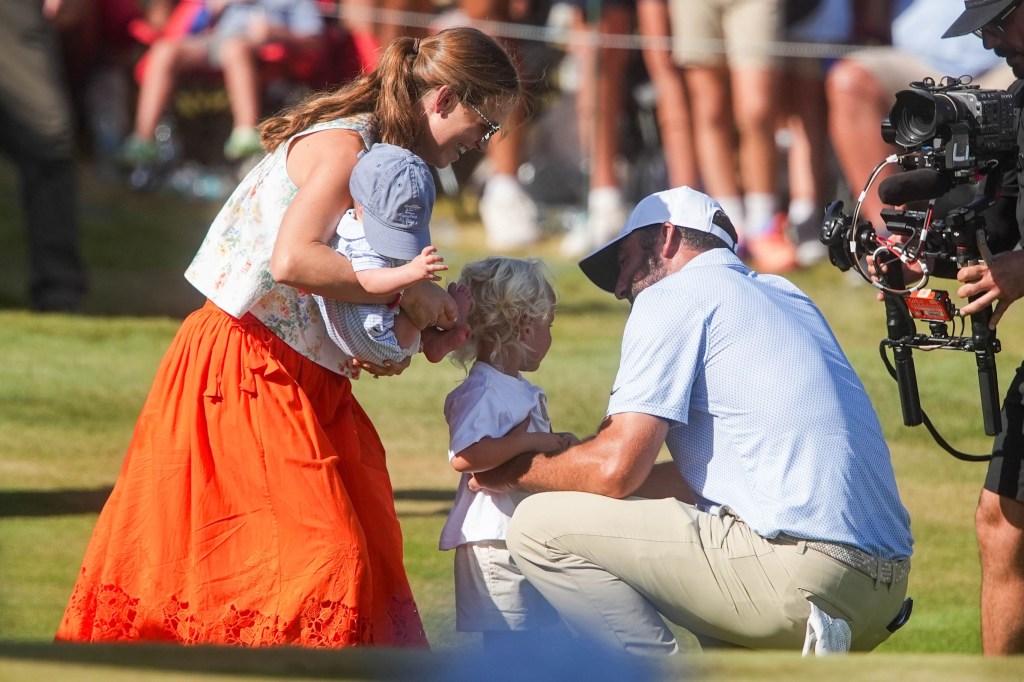 Scottie Scheffler is congratulated by his wife, Meredith Scudder, and sons Bennett, 2, and four-month-old Remy, after winning the FedEx St. Jude Championship on Sunday, Aug. 16, 2026.