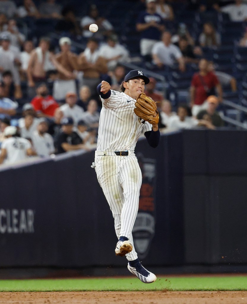 New York Yankees shortstop George Lombard Jr. (96) fields the ball during the ninth inning.