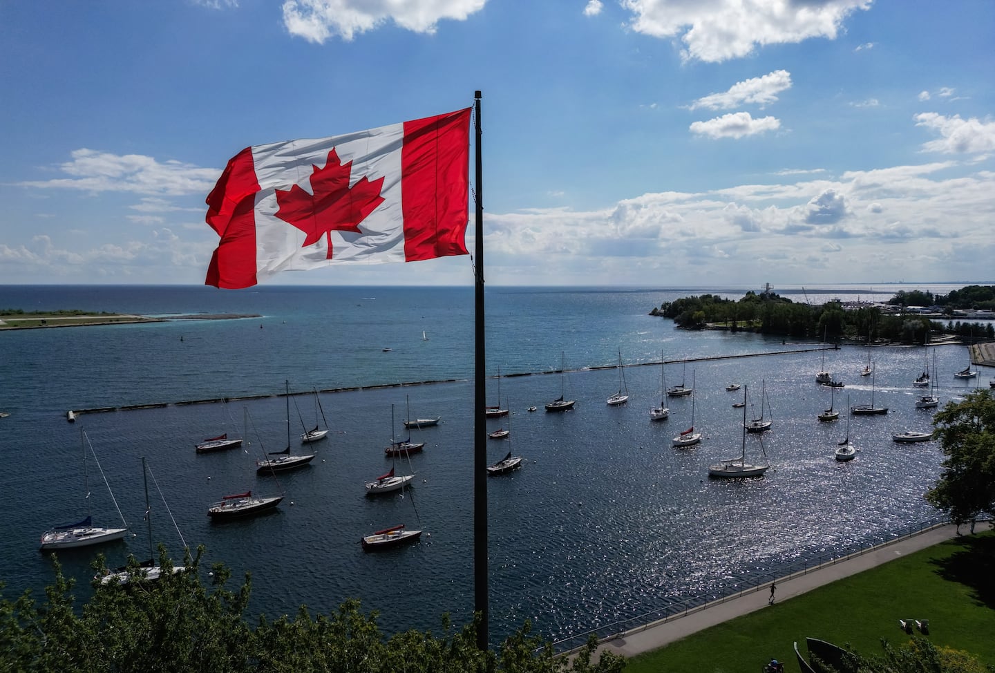 A Canadian flag flies along the waterfront of Lake Ontario, in Toronto, Ontario, Canada, on Aug 27.