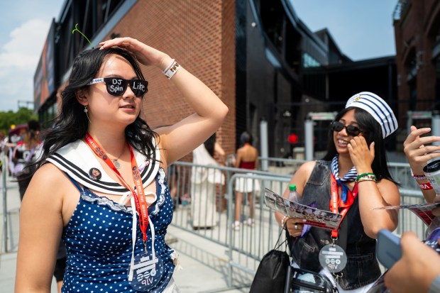 Gaithersburg native Amanda Lien, 26, waits in line at M&T Bank Stadium six hours ahead of the start of BTS' concert in Baltimore, the 16th stop on their "Arirang" World Tour. (Ryan Bowie/Staff)