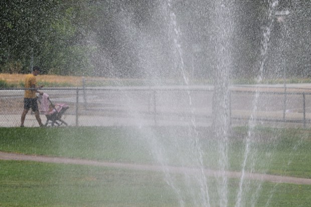 A fountain sprays water into the air at Cushing Park in Englewood on Thursday, August 13, 2026. (Photo by Hyoung Chang/The Denver Post)