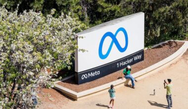 FILE - Visitors take photos at a sign outside Meta headquarters March 26, 2026, in Menlo Park, Calif. (AP Photo/Noah Berger, File)
