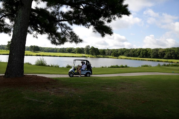 Golfers take advantage of Thursday, August 6, 2026, morning's mild weather to hit the links at the Virginia Beach National Golf Club. (Stephen M. Katz / The Virginian-Pilot)