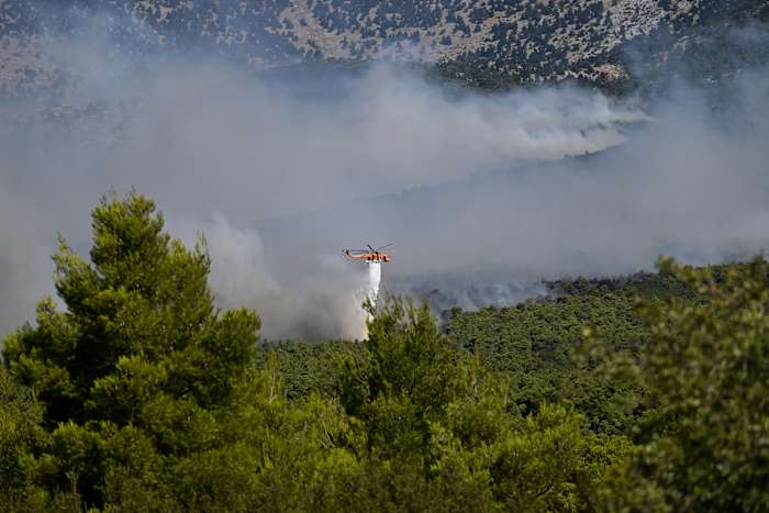 Europe’s wildfire crisis fractures as Greece evacuates and France guards megafire scar