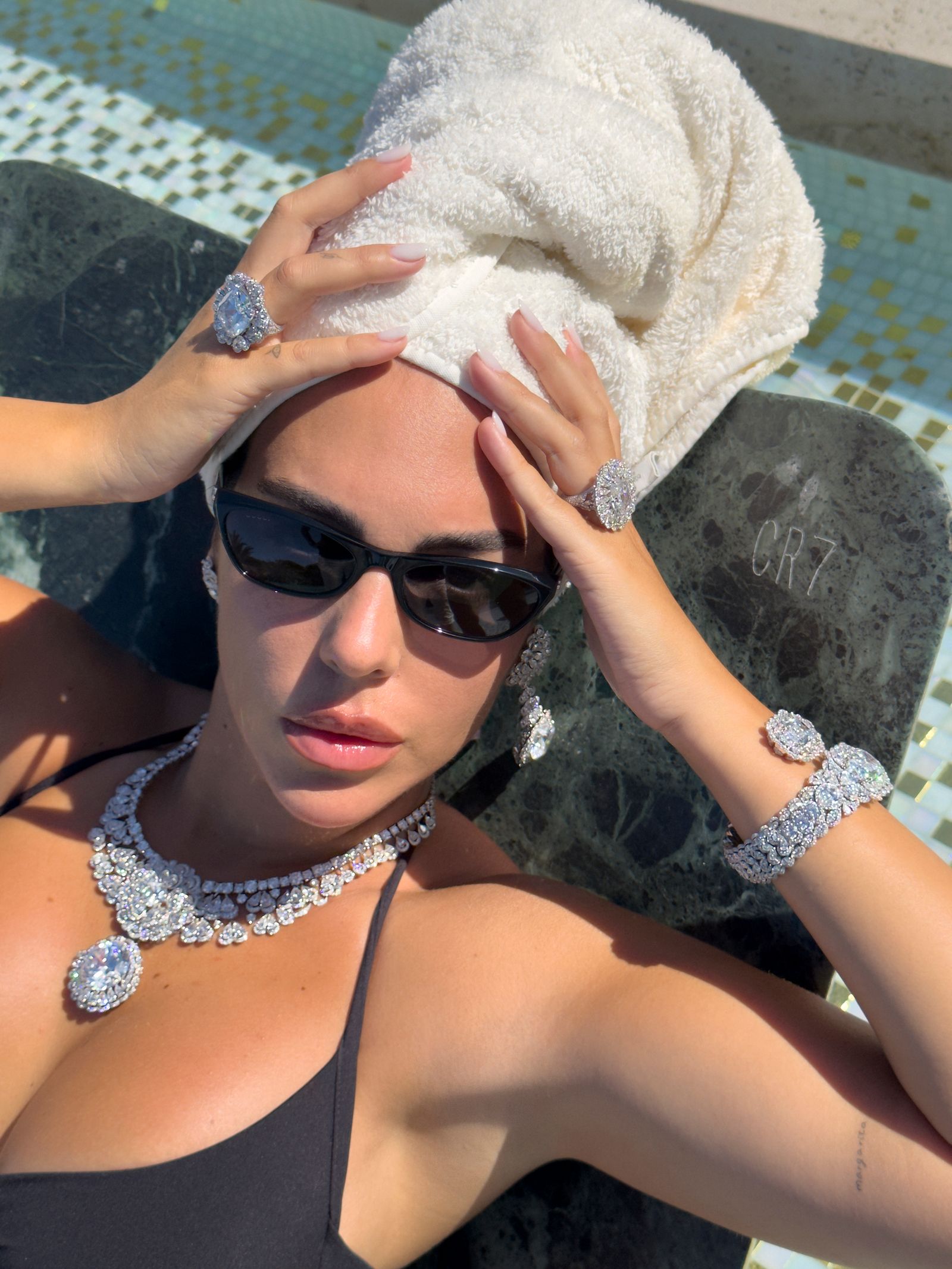 Image may contain Adult Person Accessories Sunglasses Jewelry Necklace Face Head Photography and Portrait