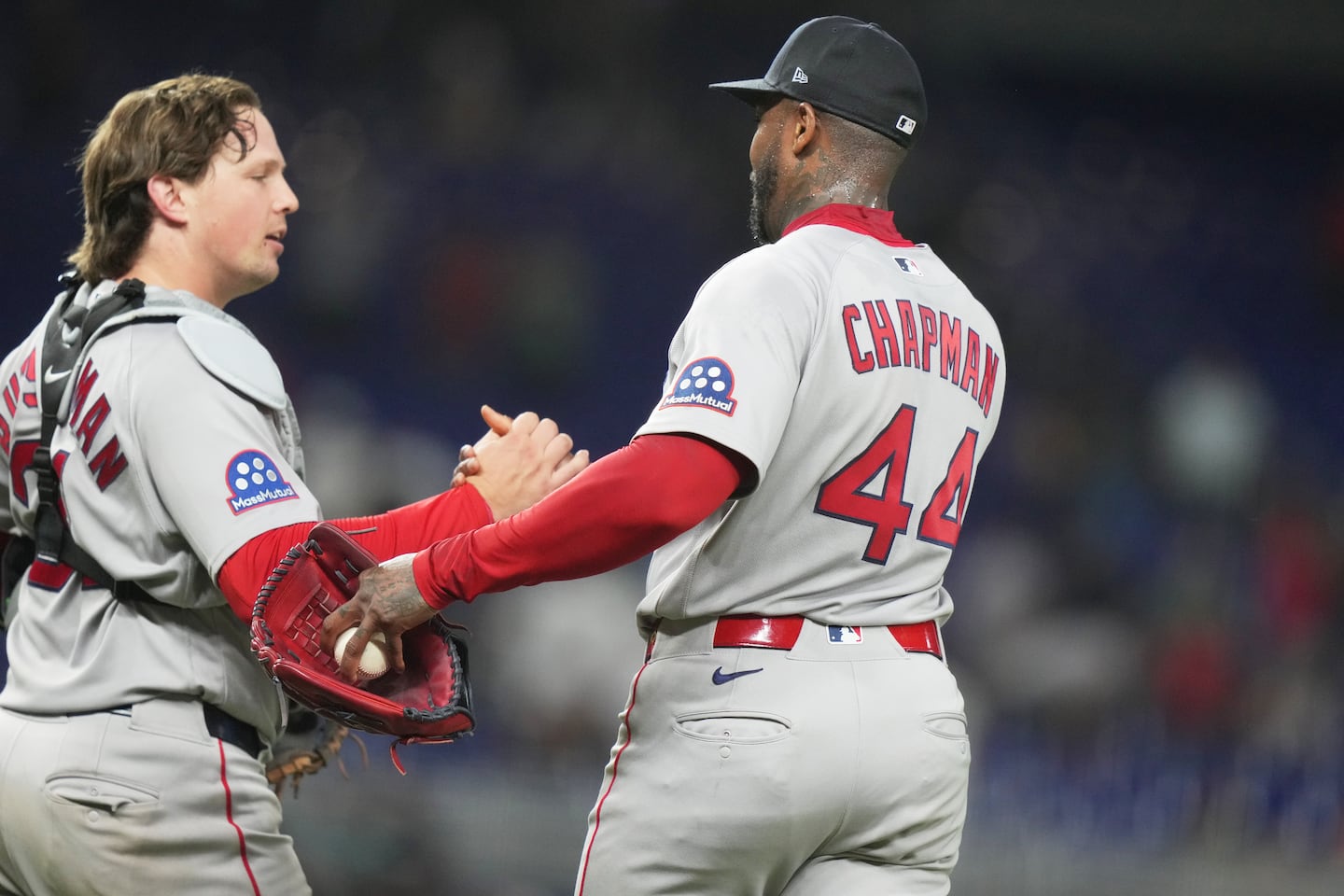 Red Sox catcher Adley Rutschman (left) was last seen on the field Monday, shaking closer Aroldis Chapman's hand after the win in Miami. Rutschman returned to the lineup Friday night for the series opener at the Yankees, and went 0 for 4 in the 1-0 loss.