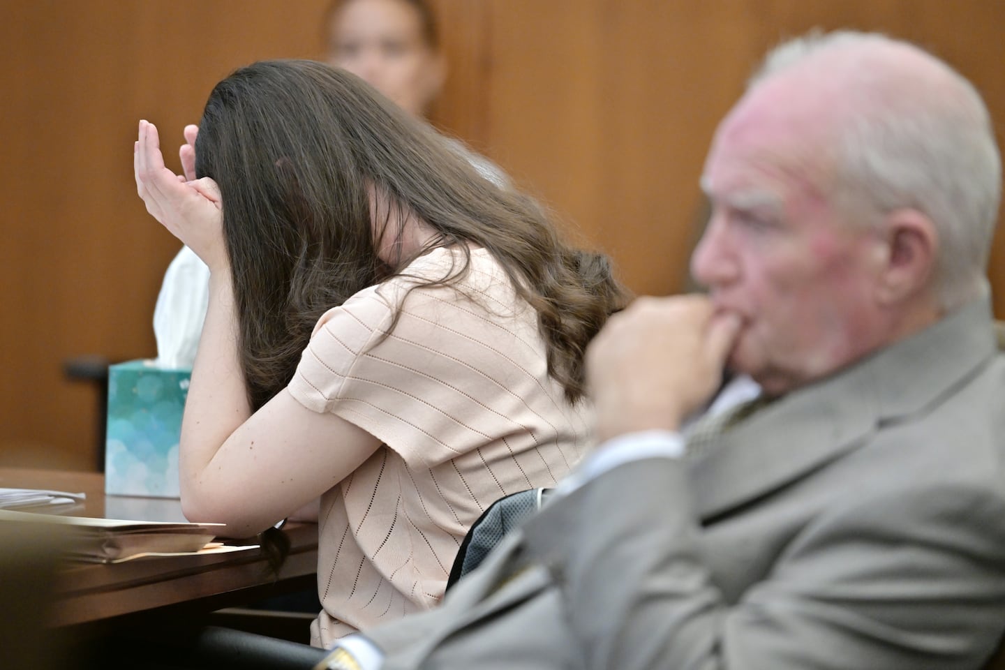Lindsay Clancy, left, reacts to the reading of her diary entries during testimony as her lawyer Kevin Reddington looks on, during testimony in the murder trial of Lindsay Clancy, Thursday, Aug. 13, 2026., in Plymouth, Mass. 