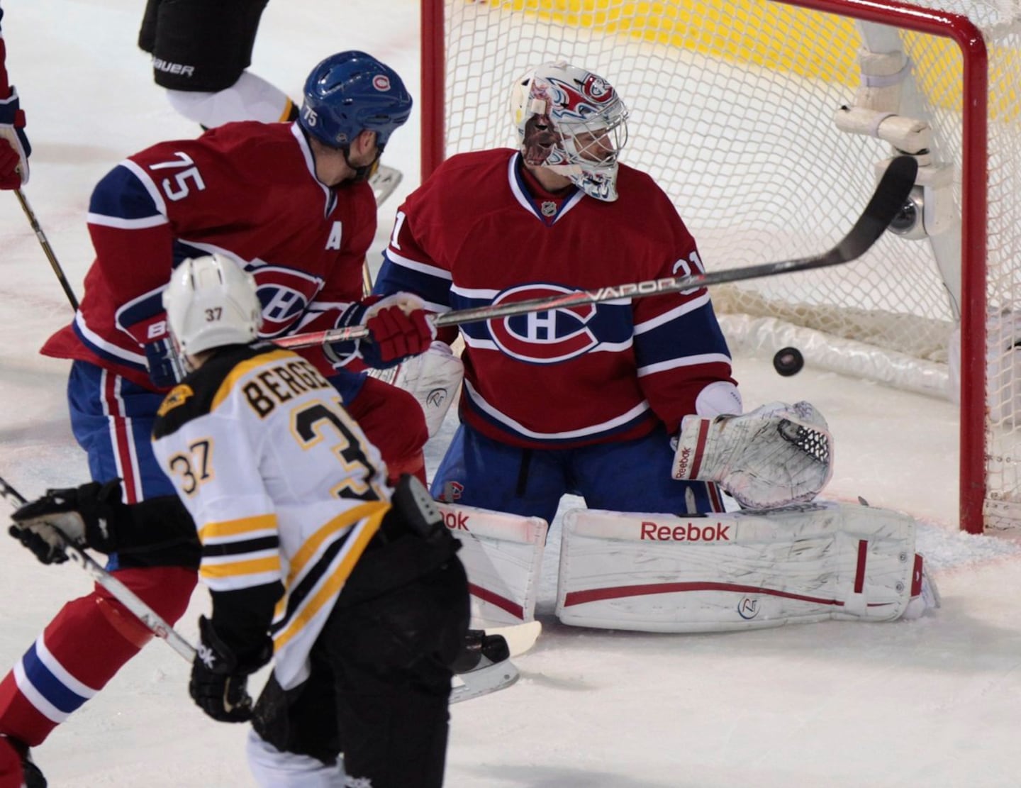 Bruins center Patrice Bergeron (37) and Canadiens goalie Carey Price had many an on-ice battle, and both will be enshrined into the Hockey Hall of Fame together on Nov. 9. 