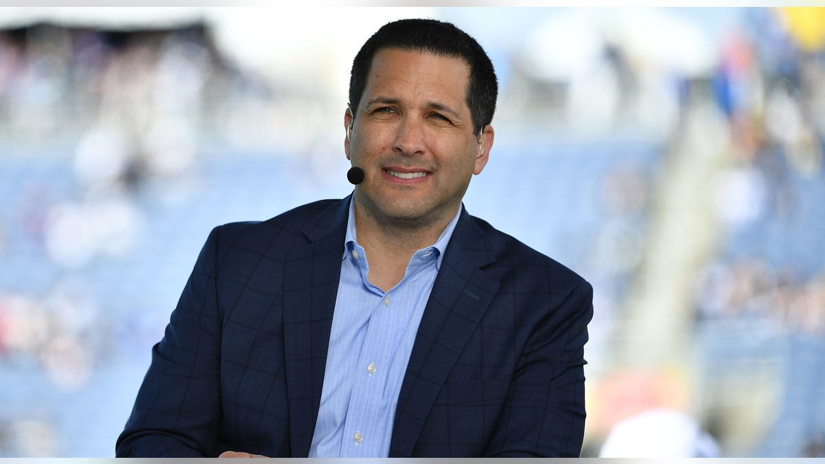 Adam Schefter smiles