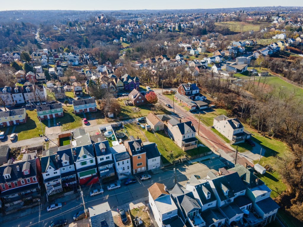 Aerial cityscape with fall foliage in residential Pittsburgh, Pennsylvania.