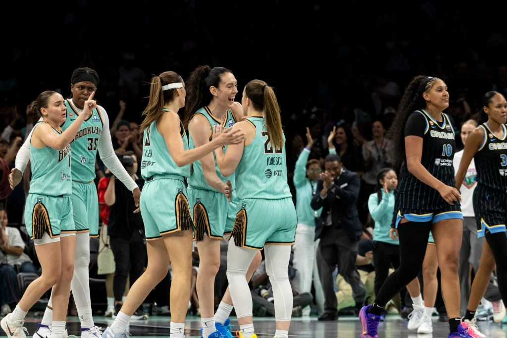 Breanna Stewart of the New York Liberty reacts to a shot over Azura Stevens of the Chicago Sky.