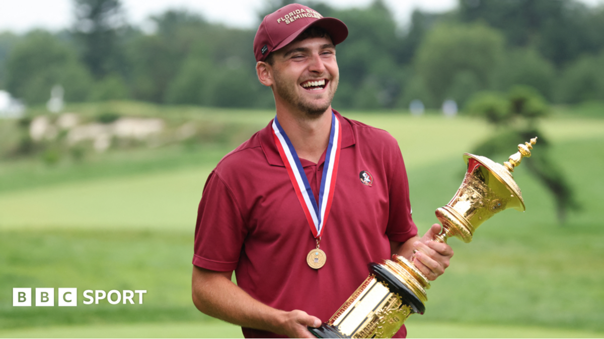Jack Whaley holding the US Amateur golf trophy