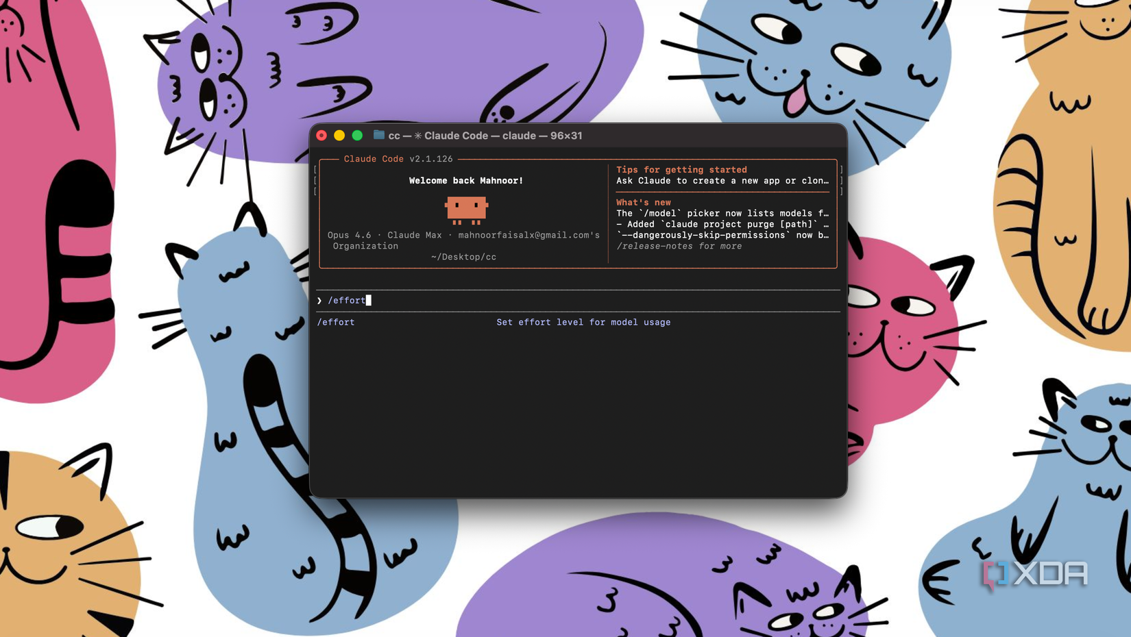 claude code displayed on terminal window on mac laptop with colorful cartoon cats surrounding the screen