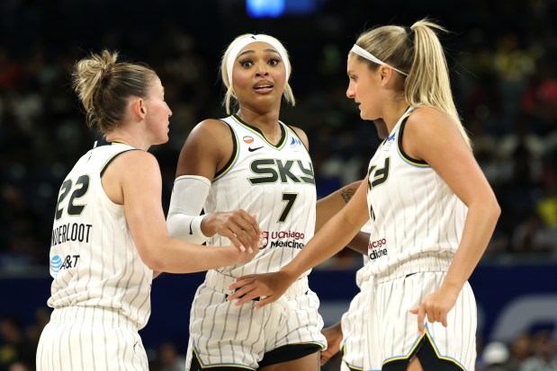 DiJonai Carrington, Courtney Vandersloot and Jacy Sheldon of the Chicago Sky huddle during the first half against the Los Angeles Sparks at Wintrust Arena on Aug. 5, 2026, in Chicago. (Geoff Stellfox/Getty Images)