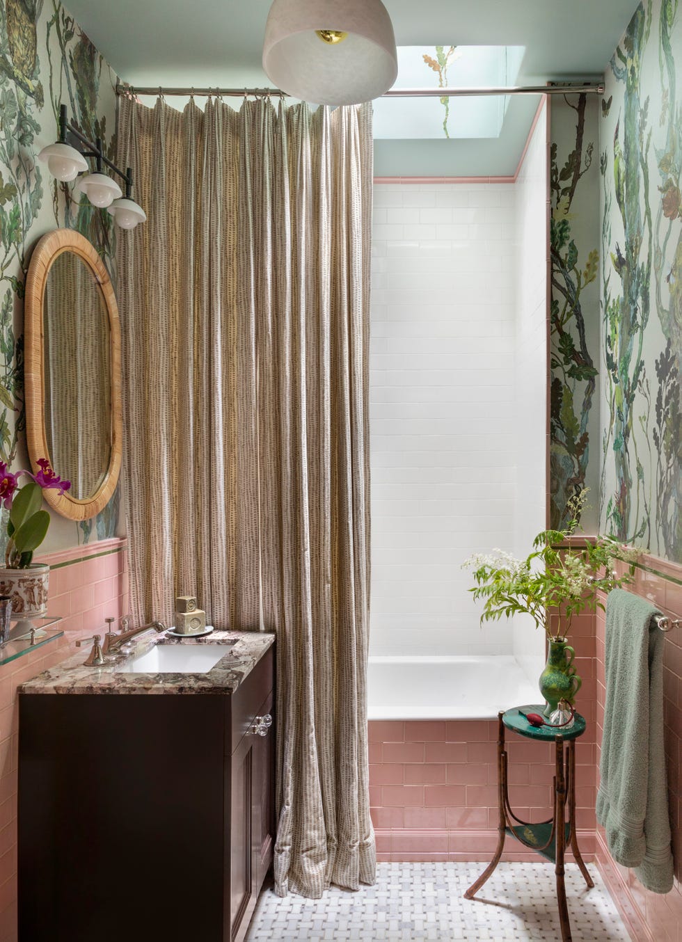 bathroom with pink tile and botanical print wallpaper