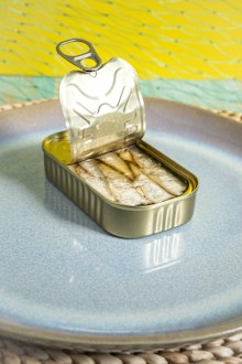 Stock image of an open tin of sardines