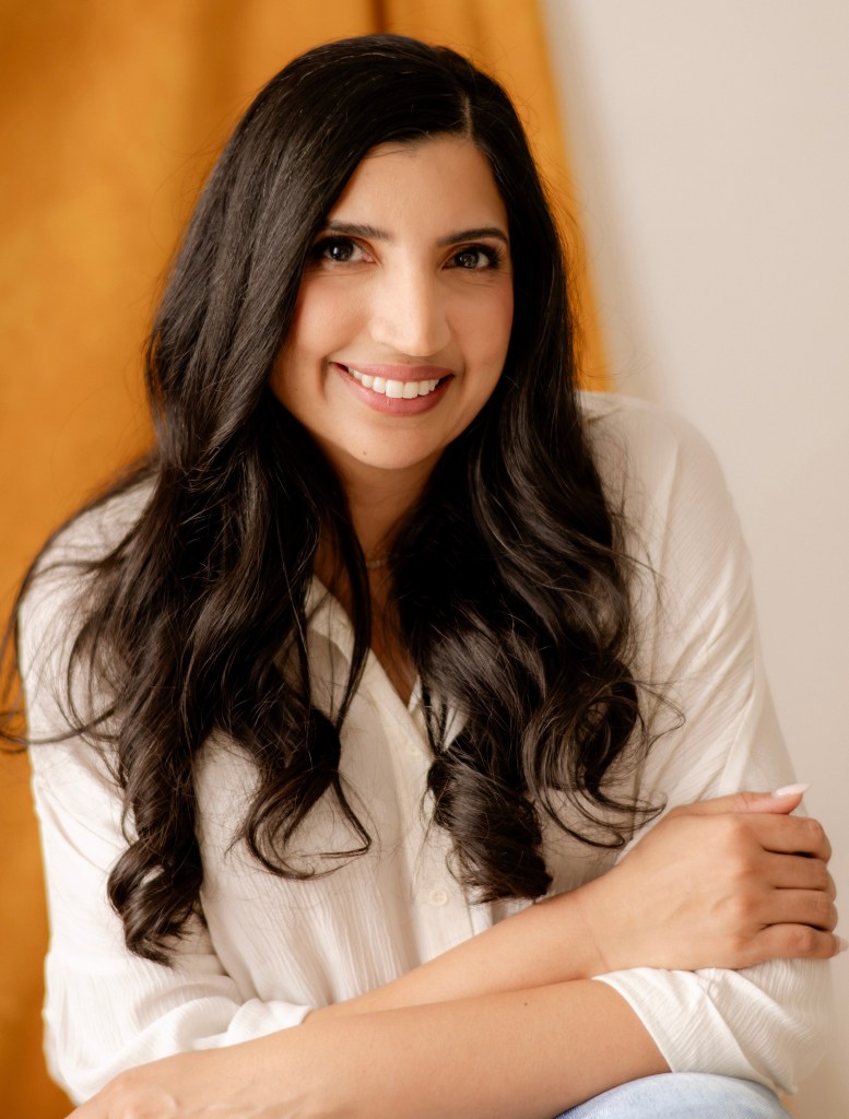 Dr. Anita Chandra smiling.