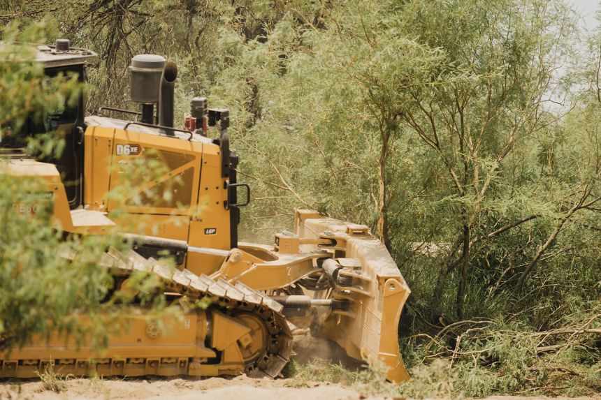 A bulldozer clears brush near the border in Big Bend National Park in Texas on August 7, 2026.