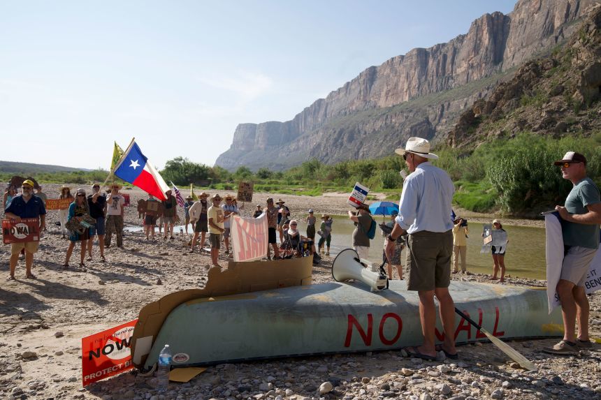 Protesters gather Wednesday near where the first bulldozer was seen inside Big Bend National Park, vowing to keep fighting against construction.