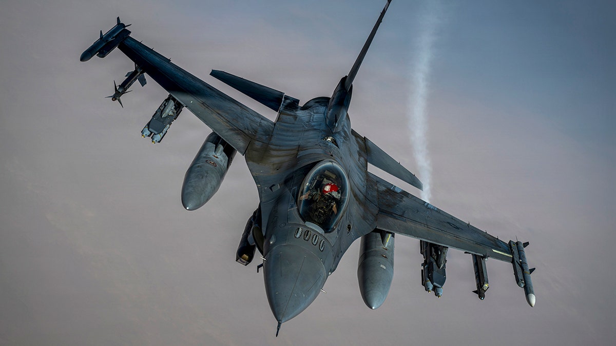 A U.S. Air Force F-16 Fighting Falcon aircraft flies in the sky.