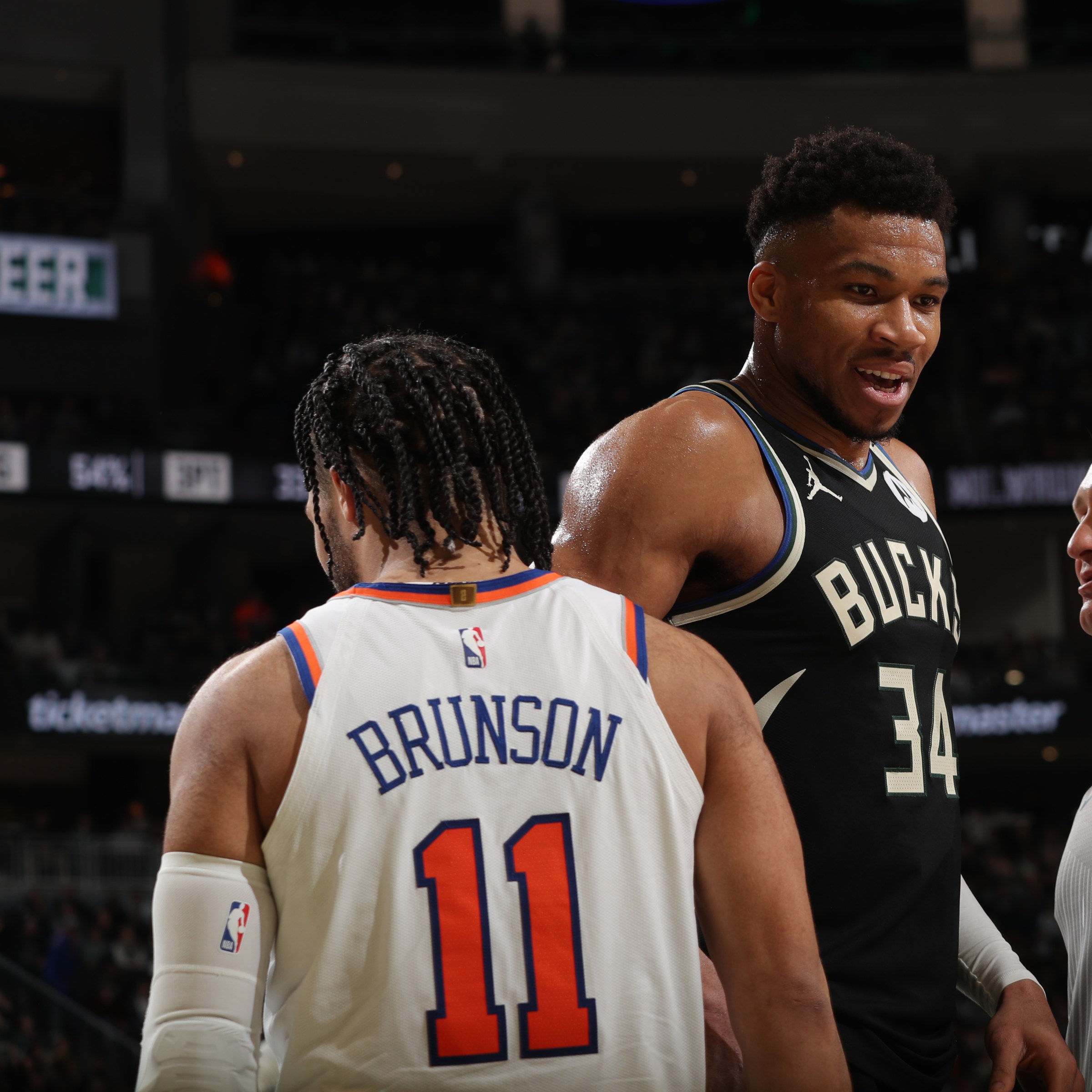 MILWAUKEE, WI - APRIL 7: Giannis Antetokounmpo #34 of the Milwaukee Bucks and Jalen Brunson #11 of the New York Knicks look on during the game on April 7, 2024 at the Fiserv Forum Center in Milwaukee, Wisconsin. NOTE TO USER: User expressly acknowledges and agrees that, by downloading and or using this Photograph, user is consenting to the terms and conditions of the Getty Images License Agreement. Mandatory Copyright Notice: Copyright 2024 NBAE (Photo by Gary Dineen/NBAE via Getty Images).