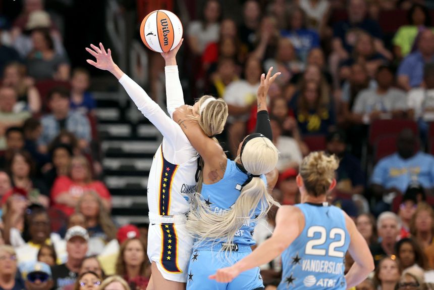 Sophie Cunningham (left) of the Indiana Fever is fouled by DiJonai Carrington (middle) of the Chicago Sky on August 8, 2026.