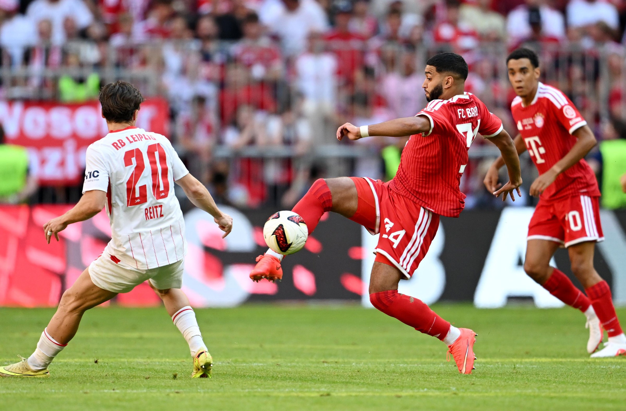 MUNICH, GERMANY - AUGUST 15: Ismael Saibari of Bayern Munich is put under pressure from Rocco Reitz of RB Leipzig during the Telekom Cup match between FC Bayern München and RB Leipzig at Allianz Arena on August 15, 2026 in Munich, Germany. (Photo by Christian Kaspar-Bartke/Getty Images)
