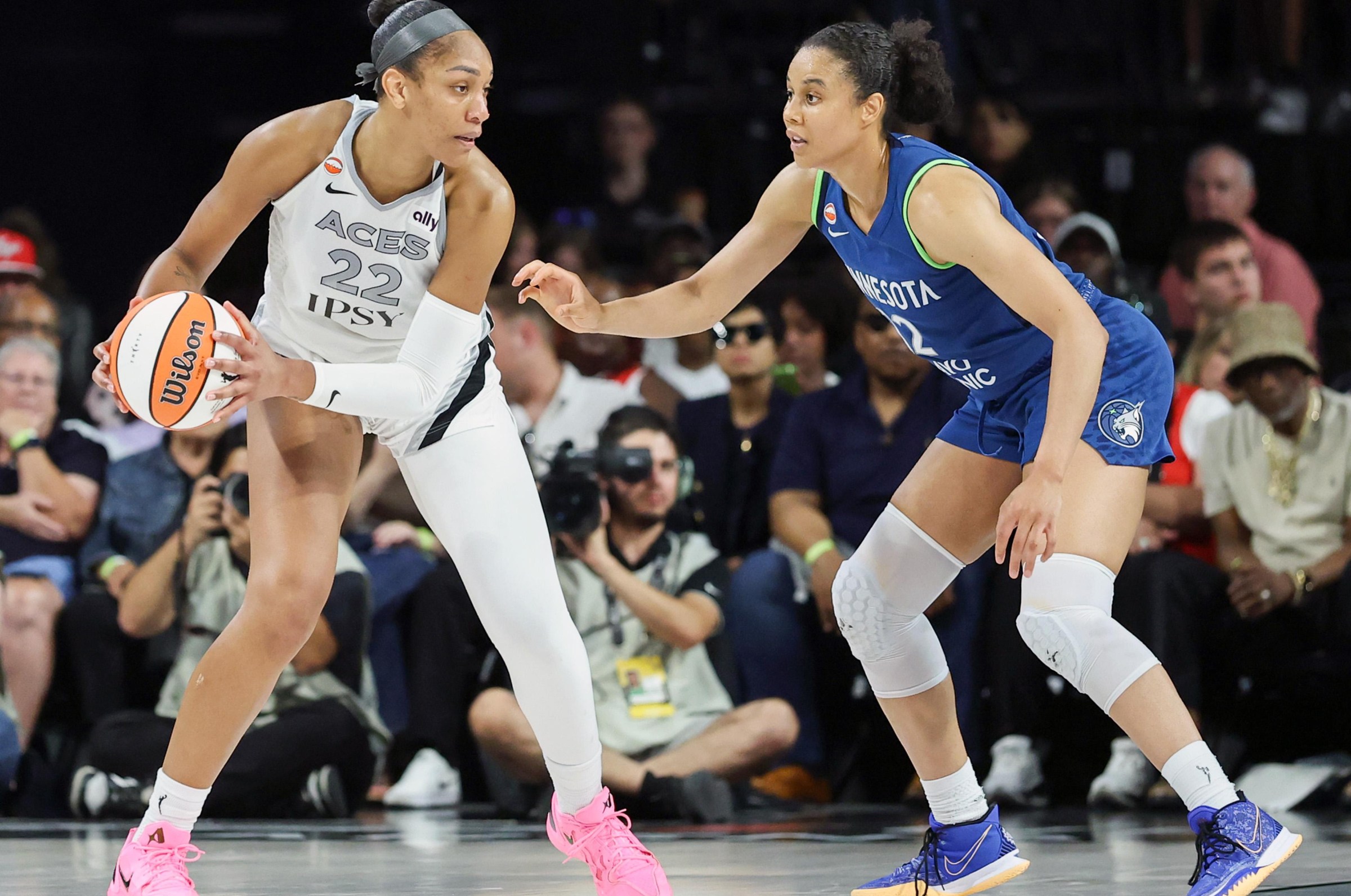 LAS VEGAS, NEVADA - AUGUST 15: A’ja Wilson #22 of the Las Vegas Aces is guarded by Nia Coffey #12 of the Minnesota Lynx in the third quarter of their game at Michelob ULTRA Arena on August 15, 2026 in Las Vegas, Nevada. The Lynx defeated the Aces 92-87. NOTE TO USER: User expressly acknowledges and agrees that, by downloading and or using this photograph, User is consenting to the terms and conditions of the Getty Images License Agreement. (Photo by Ethan Miller/Getty Images)