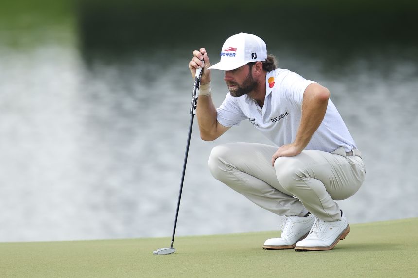 Young lines up a putt on the eighth green during the second round of the Tour Championship 2026 at East Lake Golf Club in Atlanta.