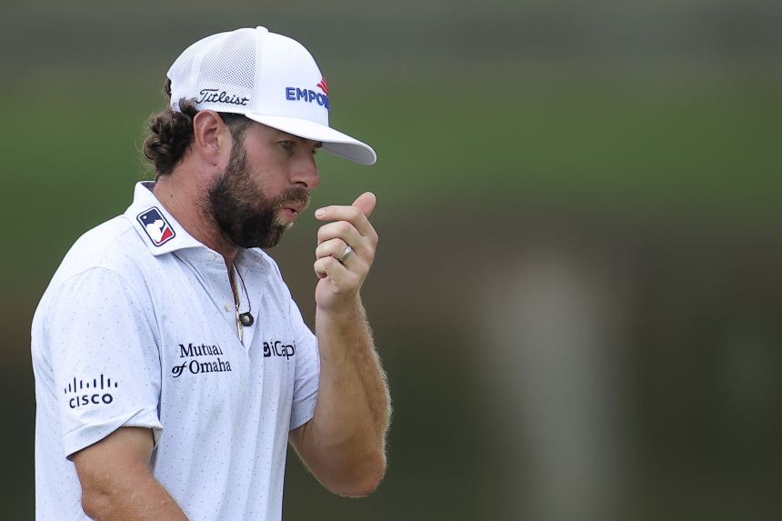 Cameron Young reacts on the eighth green during his second round 8-under 62.