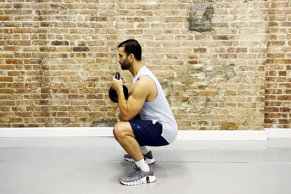 tamir practicing the goblet squat exercise tamir practicing the goblet squat exercise