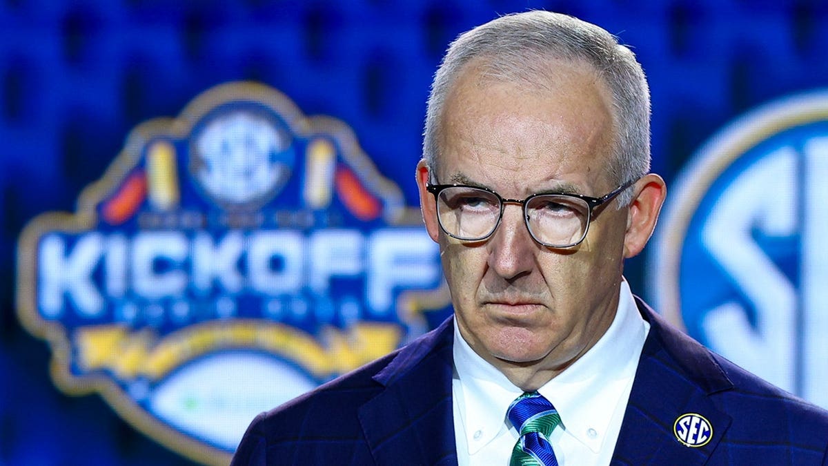 SEC Commissioner Greg Sankey speaks to reporters at a press event.