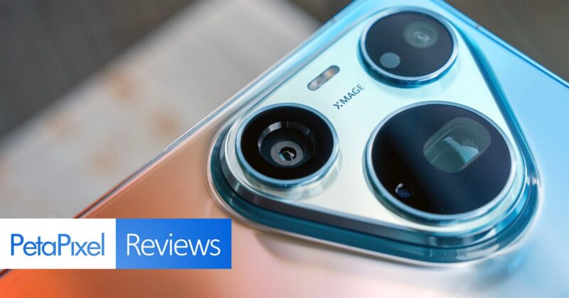 A close-up view of a smartphone camera module with three lenses and the text "XMAGE" printed on the metallic housing, with a "PetaPixel Reviews" logo in the bottom left corner.