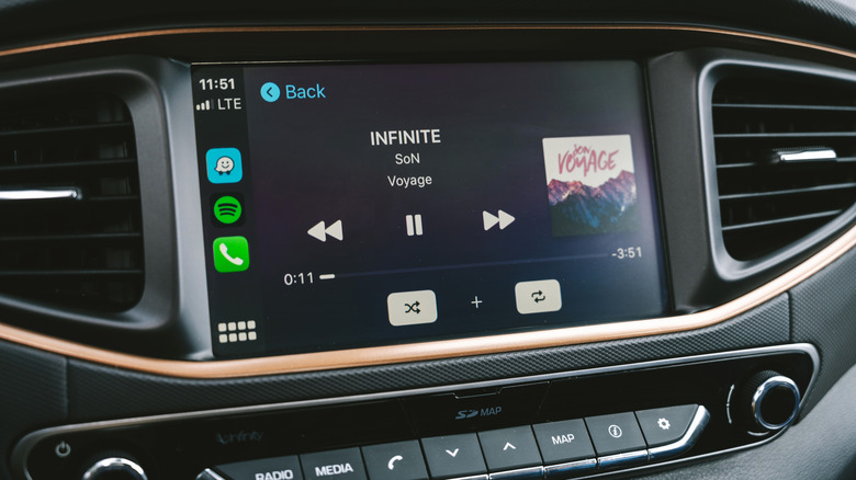 Music playing on a car display via an Apple CarPlay connection.