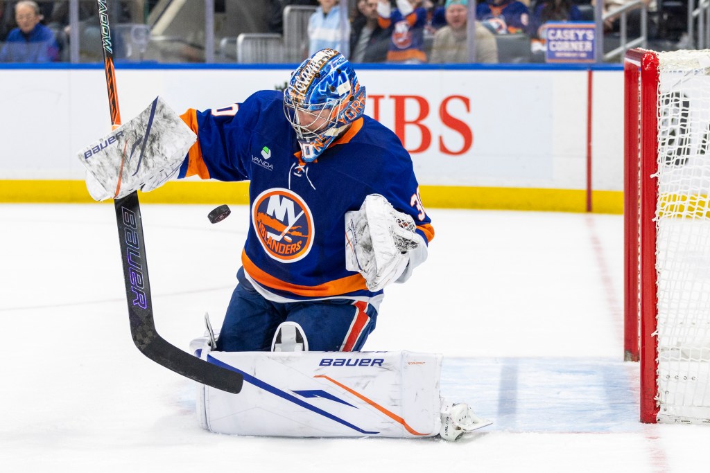 Ilya Sorokin of the New York Islanders making a save during a hockey game.