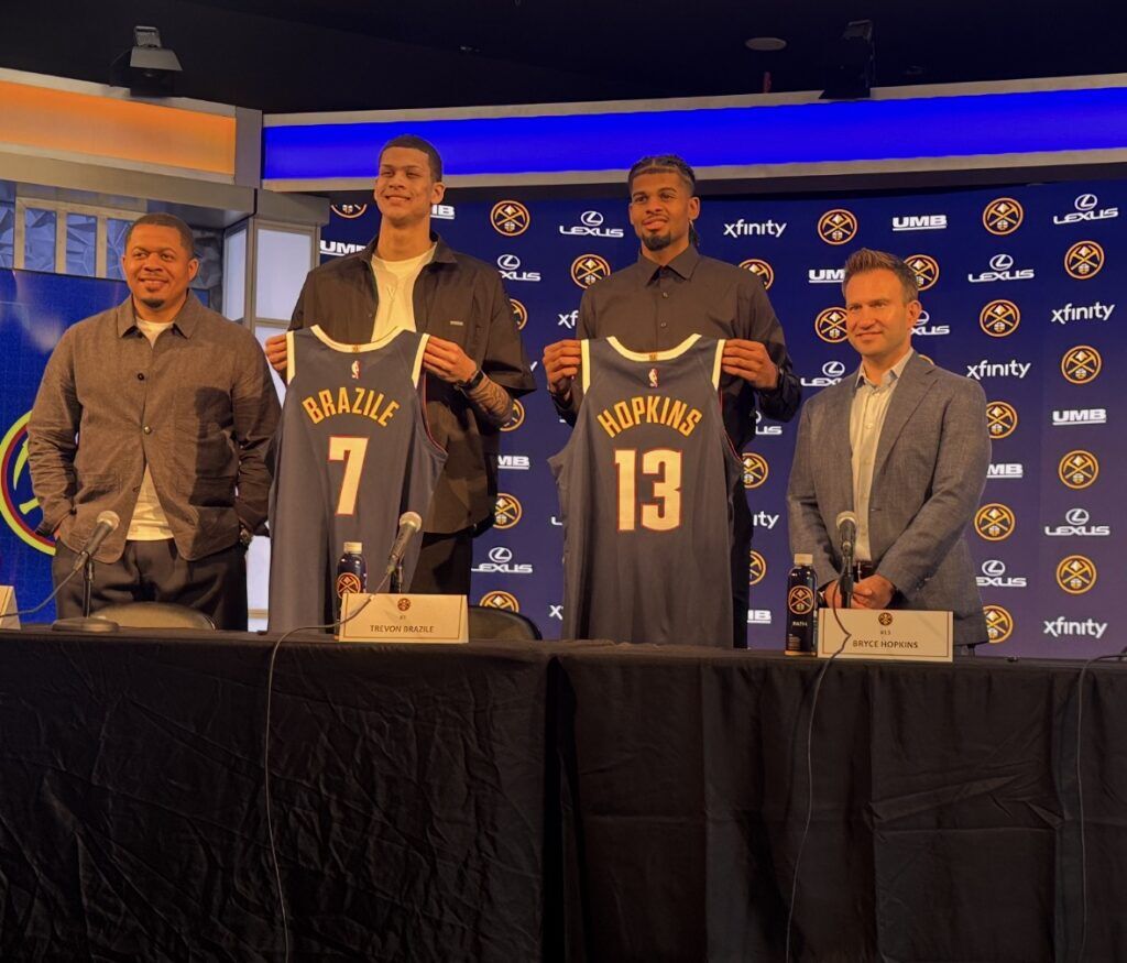 Denver Nuggets executives Jon Wallace (left) and Ben Tenzer (right) flank Trevon Brazile and Bryce Hopkins at the 2026 draft picks' introductory press conference Monday, June 29 at Ball Arena.