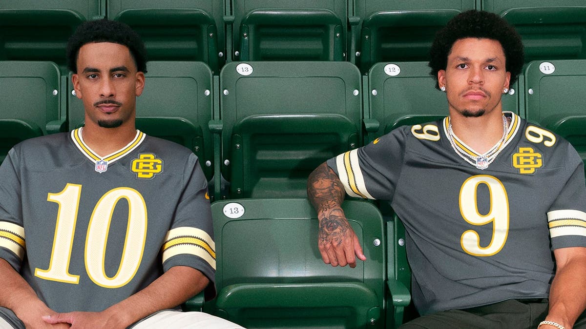 Jordan Love and Christian Watson of the Green Bay Packers wearing uniforms.