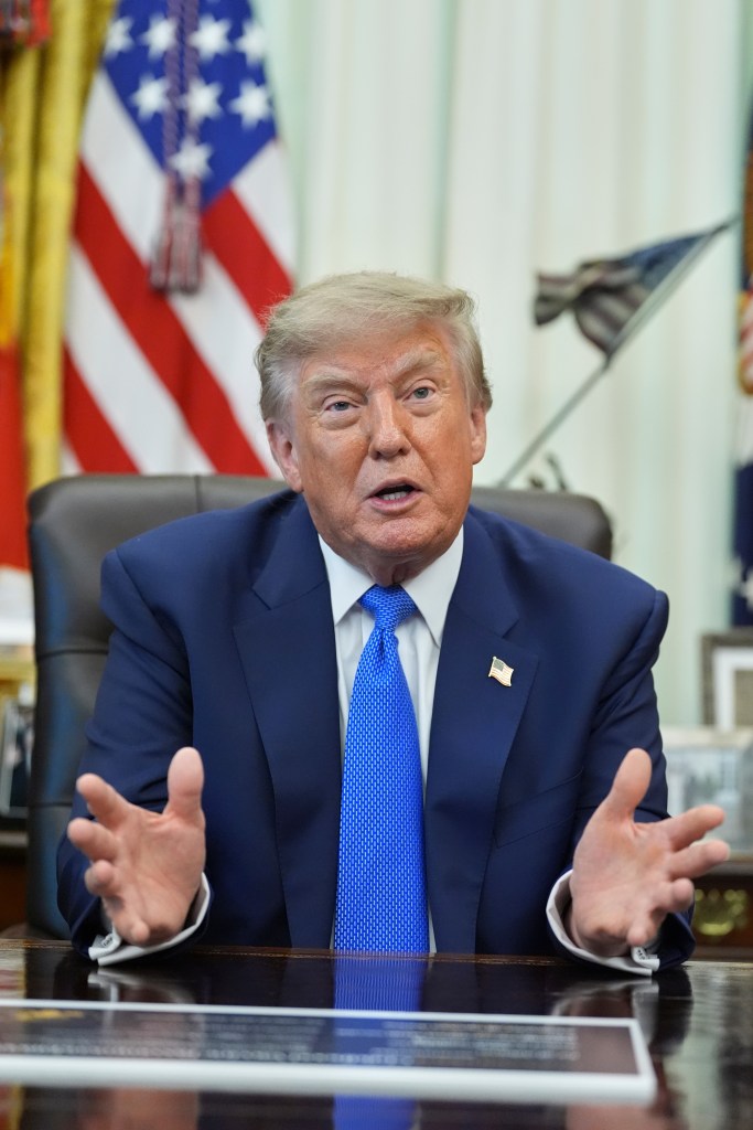 President Donald Trump speaks during a meeting in the Oval Office.