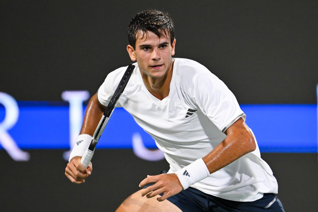 Rafael Jodar of Spain playing tennis.