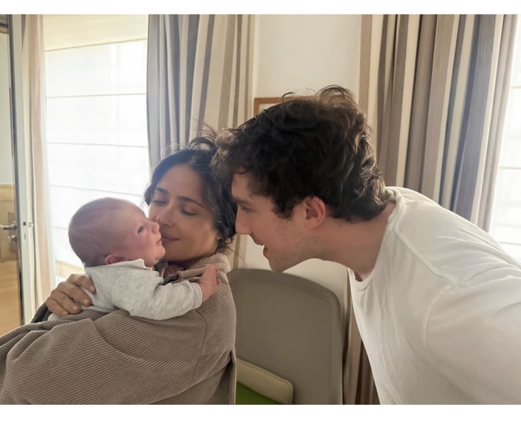 Salma Hayek with her stepson and his baby.