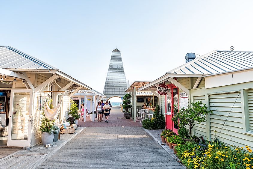 A park and pastel buildings in the town center of Seaside, Florida.