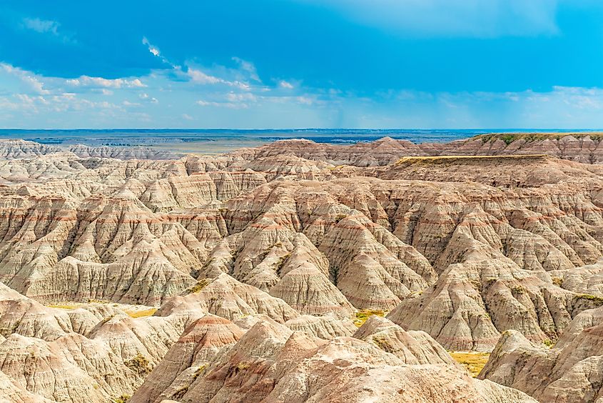 Eroded rock formations at sunset in Badlands National Park, South Dakota.