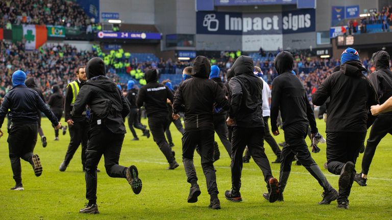 Spectators ran onto the pitch at Ibrox after Celtic beat Rangers