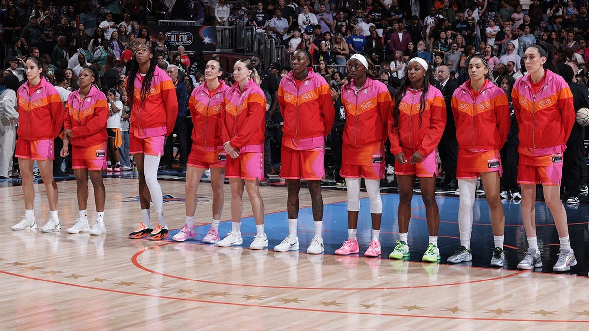 Team Coop stands for the national anthem before the WNBA All-Star game.