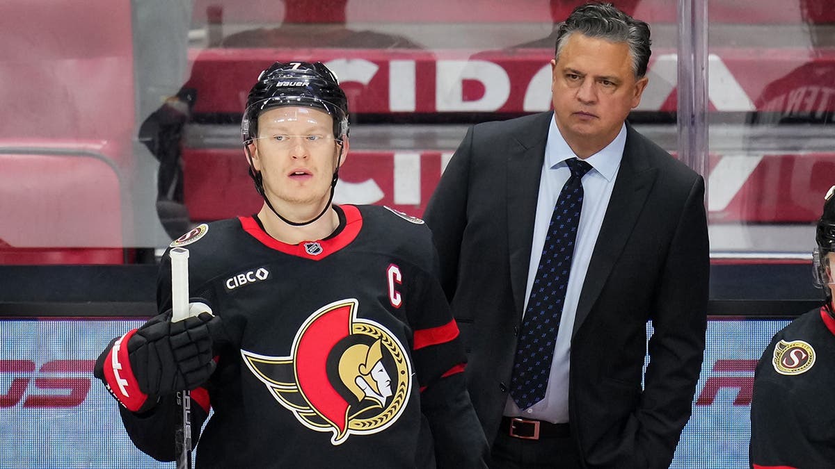 Brady Tkachuk and Travis Green